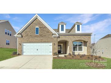 Brick two-story house with a white two-car garage and landscaped lawn at 4474 Doyle Ridge Rd, Maiden, NC 28650