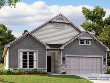 Two-story home with gray and beige siding, two-car garage, and landscaping at 5901 Oak Branch Cir, Maiden, NC 28650