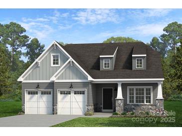 Charming two-story home with a two-car garage, stone accents, and manicured lawn at Lot 109 Mayes Meadow Dr # Woodford, Cornelius, NC 28078