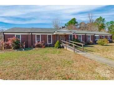 Brick ranch house with a ramp and mature landscaping at 1012 Rawlinson Rd, Rock Hill, SC 29732