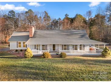 Ranch home with wraparound porch and landscaped yard at 1360 Hopewell Church Rd, Catawba, NC 28609