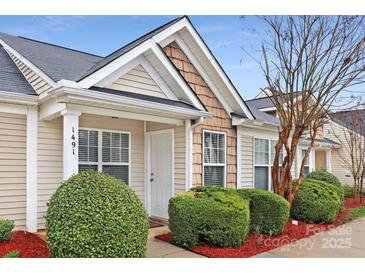 Inviting exterior of charming townhome with well-manicured landscaping at 1491 Harpers Inlet Dr, Clover, SC 29710