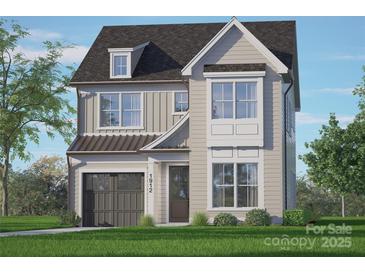 Two-story house with gray siding, dark garage door, and a well-manicured lawn at 1912 St John St, Charlotte, NC 28216