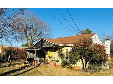 Ranch style home with brick facade and mature landscaping at 309 York Rd, Kings Mountain, NC 28086