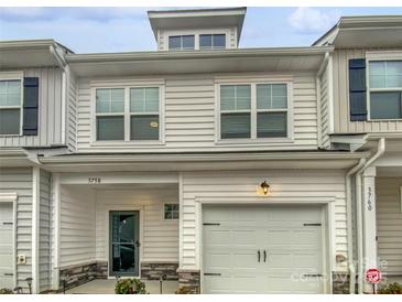 Two-story townhome with modern exterior and attached garage at 3758 Yorkshire Pl, Terrell, NC 28682