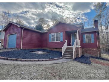 Charming ranch home with attached garage and landscaped yard at 69 Saint Charles Ct, Hickory, NC 28601