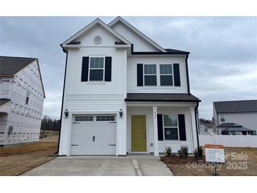 Two-story house with white siding, black shutters, and a yellow front door at 813 Gondola Ct # 107, Salisbury, NC 28144