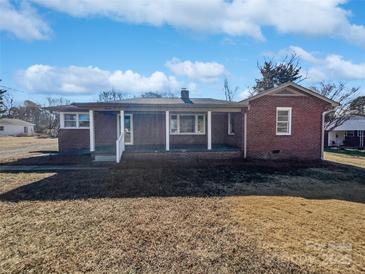 Brick ranch house with covered porch and large yard at 2042 Country Ct, Rock Hill, SC 29732