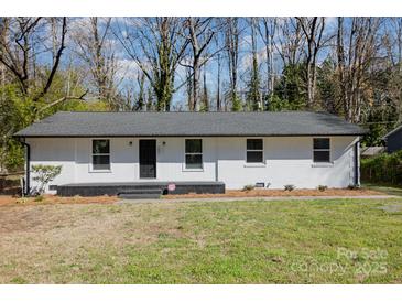 Charming single-story home featuring a freshly painted exterior, a modern roof, and a well-maintained front yard at 3843 Foxford Pl, Charlotte, NC 28215