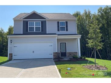 Two-story house with gray siding, a two-car garage, and a landscaped lawn at 1524 Doran Ter, Richburg, SC 29729