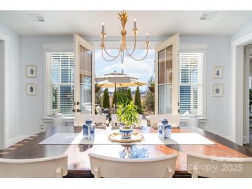 Bright dining room with French doors opening to backyard patio at 1575 Riverwalk Pkwy, Rock Hill, SC 29730