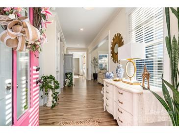 Inviting foyer with beautiful hardwood floors and elegant decor, leading to a bright and spacious home at 1575 Riverwalk Pkwy, Rock Hill, SC 29730