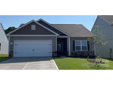 Charming house with gray siding, white garage door, and landscaped lawn at 1578 Doran Ter, Richburg, SC 29729