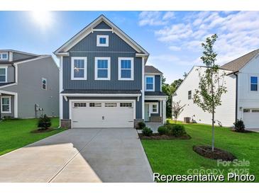 Two-story house with gray siding, white garage door, and landscaping at 2101 Morgan Hills Dr # 155P, Albemarle, NC 28001