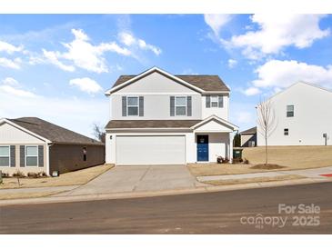 Two-story house with white siding, a two-car garage, and a blue front door at 2513 Celestial Dr, Newton, NC 28568