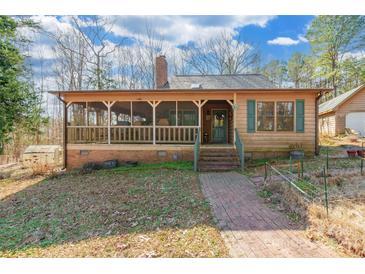 Inviting home with a screened porch and brick pathway at 3870 Elkwood Ct, Concord, NC 28025