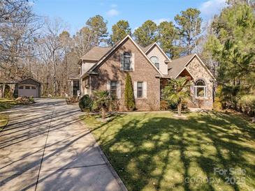 Brick house with attached garage and landscaped lawn at 4070 Timber Crossing Dr, Rock Hill, SC 29730