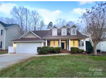 Two-story house with a large yard and attached garage at 8249 Chatham Oaks Dr, Concord, NC 28027