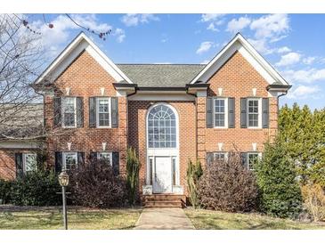 Traditional brick home with a large arched window above the front door at 2102 Sipe Rd, Conover, NC 28613