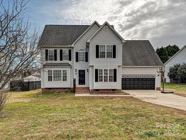 Two-story house with gray siding, black shutters, and a two-car garage at 364 Holstein Dr, Dallas, NC 28034