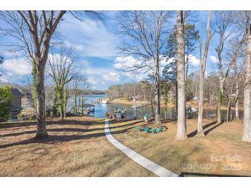 Lakefront property with a relaxing seating area and walkway at 604 Beaten Path Rd, Mooresville, NC 28117