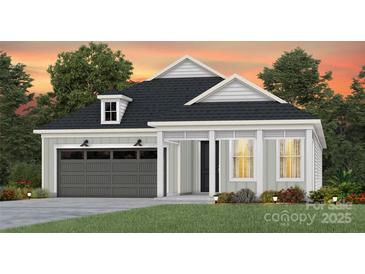 Craftsman style home with gray siding, dark gray garage door, and landscaping at 4784 Formation Ct # 066, Lancaster, SC 29720