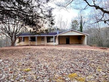 Ranch style house with attached carport and partially wooded yard at 6862 Royal Heights Cir, Hickory, NC 28602