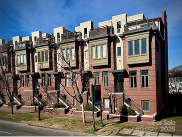 Brick townhouses with private balconies and street parking at 701 N Church St # 9, Charlotte, NC 28202