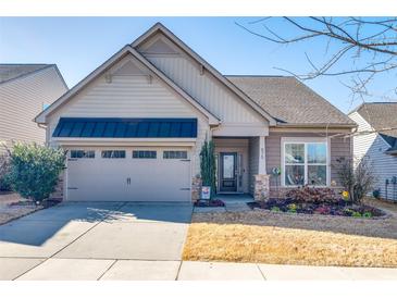 Curb appeal abounds in this charming house with a welcoming front porch at 975 Shorthill Ln, Fort Mill, SC 29715