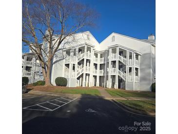 White two-story building with multiple entrances and parking at 15 Hamiltons Bay Ct # A939, Lake Wylie, SC 29710