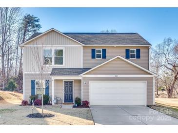 Two-story house with neutral siding, a two-car garage, and landscaping at 1529 Cannan Mountain Dr, Newton, NC 28658