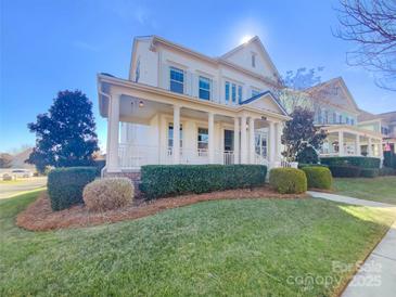 Two-story house with a front porch and manicured lawn at 2219 Lochview St, Pineville, NC 28134