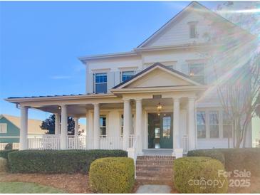 Two-story home with front porch and landscaped yard at 2219 Lochview St, Pineville, NC 28134