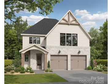 Charming two-story home featuring a brick facade, a two-car garage, and a beautifully landscaped front yard at 3021 Kinger Ln, Matthews, NC 28105