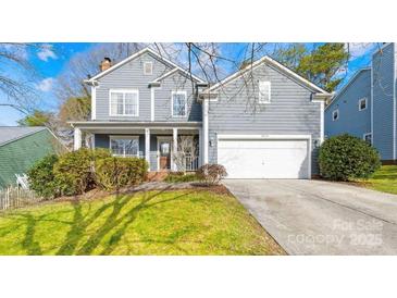 Charming two-story home with a well-maintained lawn and inviting front porch at 10105 Bon Meade Ln, Cornelius, NC 28031