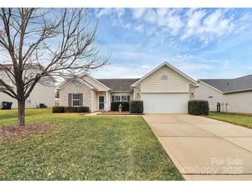 Charming one-story home with a well-manicured lawn and attached two-car garage at 3134 Sterling Ct, Fort Mill, SC 29707