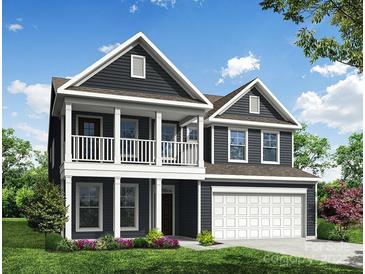 Two-story house with gray siding, white trim, and a two-car garage at 6911 Fauna Dr # 60, Charlotte, NC 28215