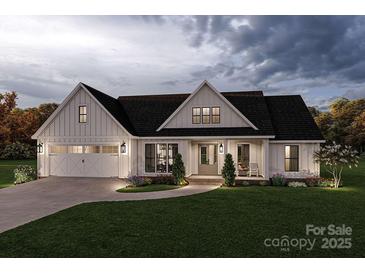 Charming single-Gathering home with a well-manicured lawn, a two-car garage, and inviting front porch at 000 Ridgecrest Rd # 10, Locust, NC 28097