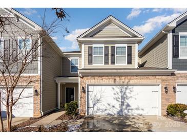 Attractive two-story townhome with a two-car garage and landscaping at 1206 Croft Dr # 98, Fort Mill, SC 29708