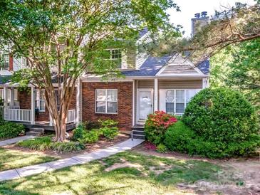 Brick front townhouse with landscaping and walkway at 709 Mountainwater Dr, Charlotte, NC 28262