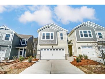 Charming exterior featuring a white garage door, neutral siding, and well-manicured landscaping at 260 Laura Elizabeth Ln, Clover, SC 29710