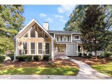 Gray house with stone accents and double doors, nicely landscaped at 3013 Southampton Cir, Gastonia, NC 28056