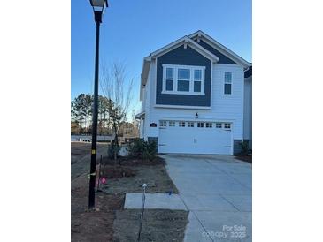 Two-story house with gray siding, white accents, and a two-car garage at 624 Cassidy Ct, Clover, SC 29710