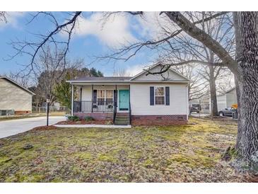 Charming single-story home with a cozy front porch and well-maintained lawn at 776 Washington Ln, Kannapolis, NC 28083