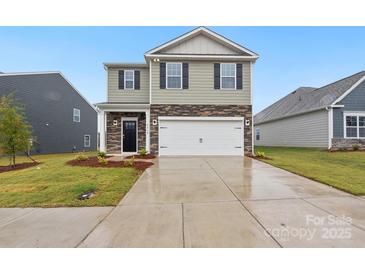 Two-story home with stone and siding exterior, two car garage at 8048 Plymouth Rd, Sherrills Ford, NC 28673