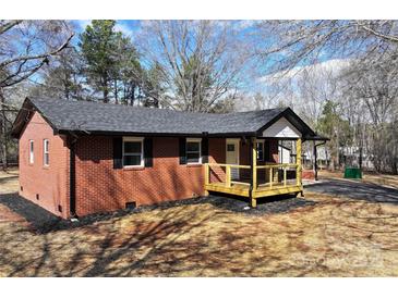 Brick ranch house with new deck and landscaping at 303 Patterson Farm Rd, Mooresville, NC 28115