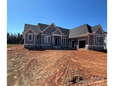 New construction featuring a stone foundation and a three car garage at 6098 Ballard Rd, Denver, NC 28037