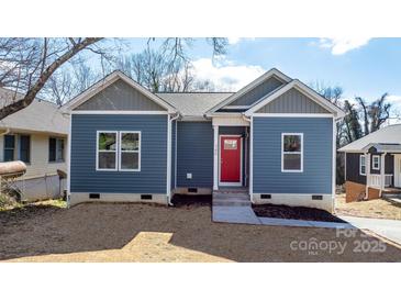 Newly built home with blue siding, red door, and landscaped yard at 140 3Rd Se Ave, Hickory, NC 28602