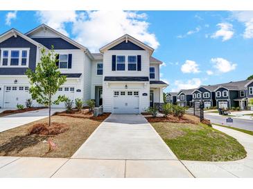 Charming two-story home with a well-manicured front yard and inviting driveway at 604 Cassidy Ct, Clover, SC 29710