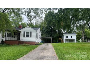 Two white homes on a large lot with a shared driveway and mature trees at 1618 4Th St, Salisbury, NC 28144
